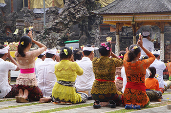 women kneeling and praying