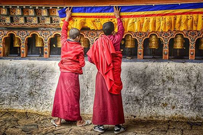 bhutan local children in red robes